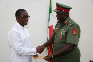  Delta State Governor, Senator Ifeanyi Okowa (left) and Brig Gen. Efemena Edafiogho, during a courtesy call on the Governor, in Government House Asaba. PIX; JIBUNOR SAMUEL.